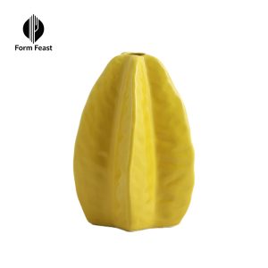 Form Feast glossy star fruit shaped ceramic vase, yellow and green options