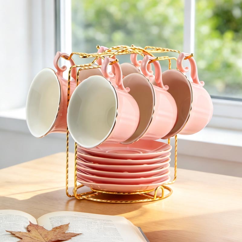 Pink HA-2023 12-piece ceramic coffee cup and saucer set on wooden table - Form Feast