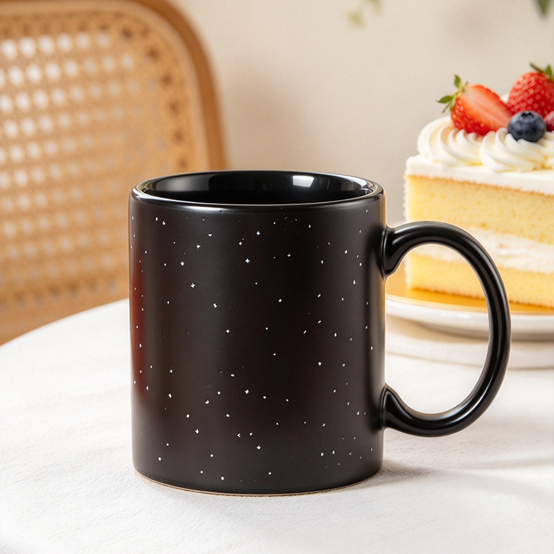 Black constellation mug cold state on table with cake - Form Feast