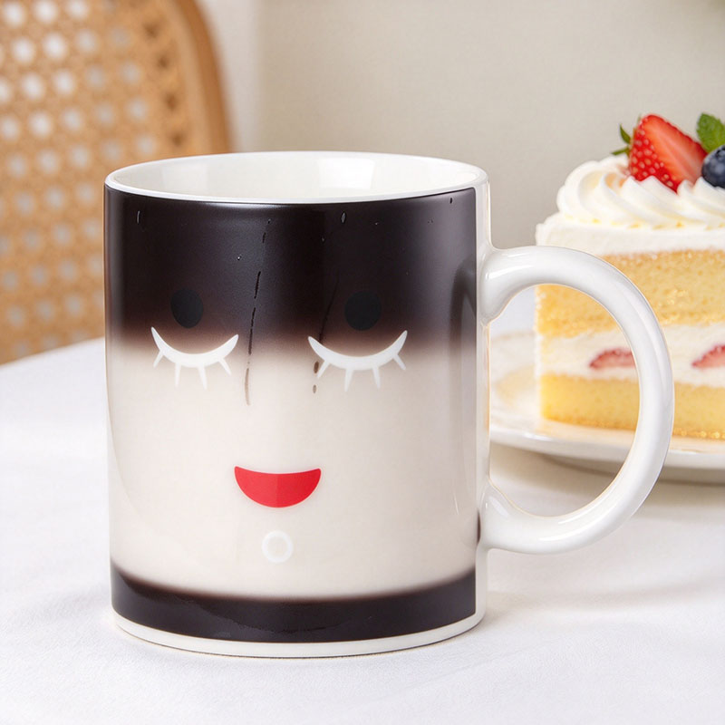 Black sleeping face mug showing open eyes after hot water - Form Feast