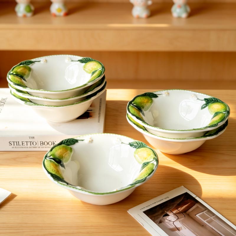 Hand-painted lemon ceramic bowls set on table - Form Feast